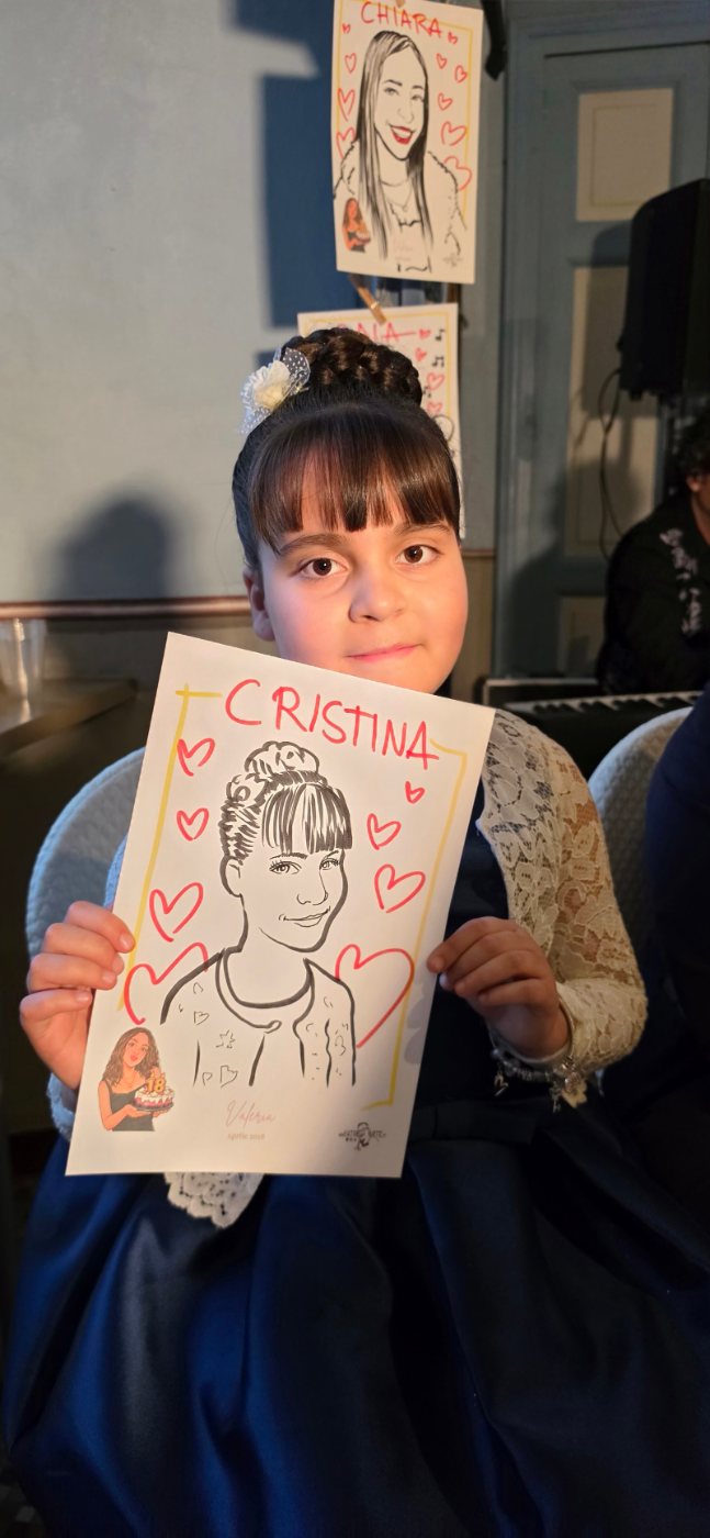 Bambina con la sua caricatura dal vivo
